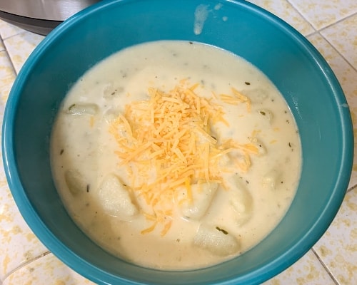 creamy potato soup in blue bowl