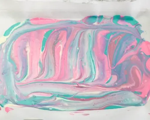 candy melts swirled together on baking sheet
