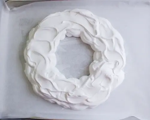 circle of meringue mixture on parchment