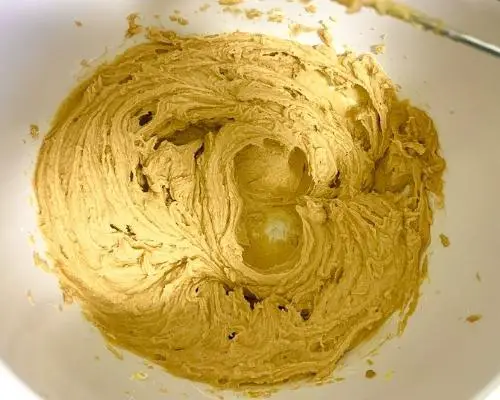 blended wet ingredients for peanut butter cookies in white bowl