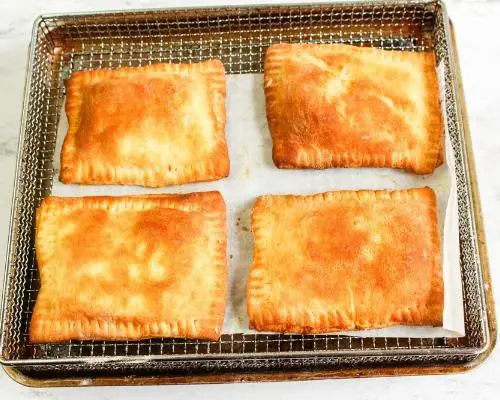 cooked ham and cheese pockets in air fryer basket