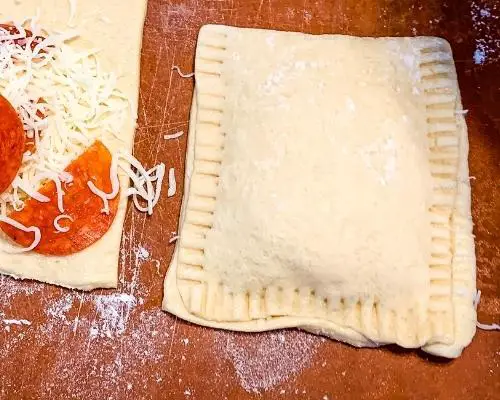 uncooked pizza pocket with crimped edges
